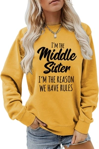 Detail of yellow round neck sweatshirt featuring I'm the Middle Sister slogan print