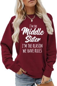 Detail of burgundy pullover sweatshirt featuring white 'Middle Sister' letter printing