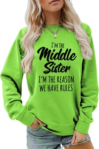 Detail of neon green crewneck sweatshirt with black I'm the middle sister text print