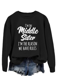 Detail of 'I'm The Middle Sister' text print on black crewneck long sleeve sweatshirt