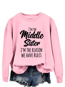 Detail of pink crewneck sweatshirt featuring I'm the Middle Sister slogan print