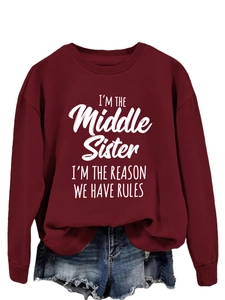 Detailed close-up of 'Middle Sister' white text print on a burgundy crewneck sweatshirt