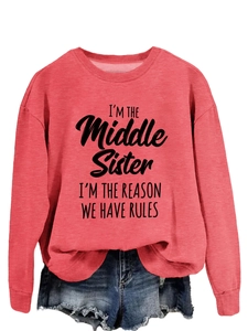 Detail of red crewneck sweatshirt featuring black 'I'm the Middle Sister' printed slogan