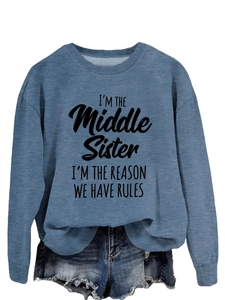 Detail of blue crewneck sweatshirt featuring I'm the Middle Sister slogan print
