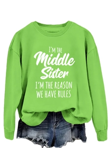 Detail of green long sleeve sweatshirt with I'm the Middle Sister white letter print