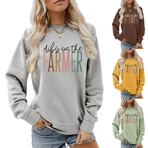 Detail view of round neck sweatshirts with dibs on the farmer print in four colors