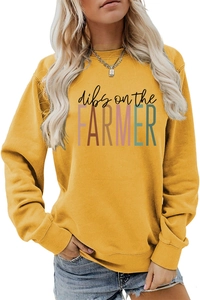 Detail of loose-fit mustard yellow sweatshirt featuring dibs on the farmer print