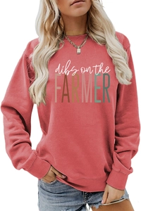 Detail of coral red crewneck sweatshirt featuring dibs on the farmer graphic print