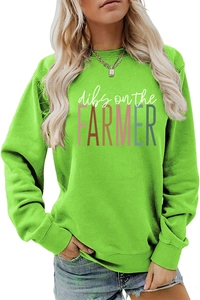 Close-up of bright green long sleeve sweatshirt with dibs on the farmer lettering