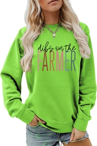 Detail of dibs on the FARMER print on a bright green crewneck long sleeve sweatshirt