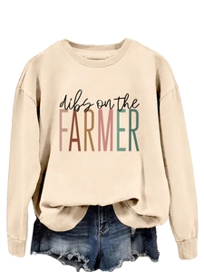 Detail of ribbed cuffs and dibs on the farmer print on beige crewneck sweatshirt