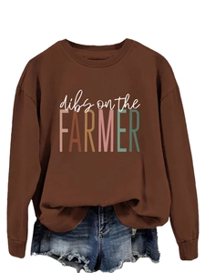 Detail view of dark brown crewneck sweatshirt with colorful dibs on the farmer print
