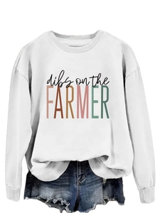 Detail of white crewneck sweatshirt featuring dibs on the farmer graphic print