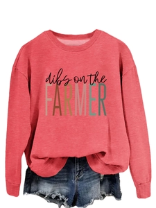 Close-up of red crewneck sweatshirt with dibs on the FARMER print and ribbed cuffs