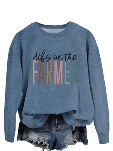 Flat lay of a blue sweatshirt with dibs on the farmer print and denim shorts set