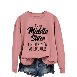 Pink crewneck sweatshirt with 'I'M THE Middle Sister' text and frayed denim shorts set