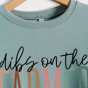 Light teal oversized sweatshirt with Dibs on the Farmer graphic and ribbed crew neck