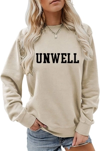Close-up of UNWELL bold lettering print on sand beige crewneck sweatshirt texture