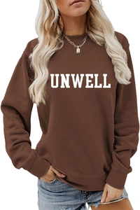 Detail of white UNWELL print on a dark brown crewneck sweatshirt with ribbed cuffs