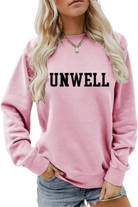 Detail of pink crewneck sweatshirt with bold black UNWELL lettering and ribbed cuffs