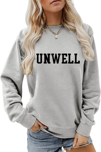 Close-up of the black UNWELL bold letter print on a grey long-sleeve cotton sweatshirt