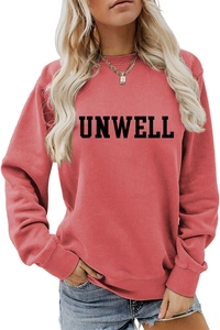 Detail of UNWELL slogan print on rose red long sleeve sweatshirt with ribbed crew neck
