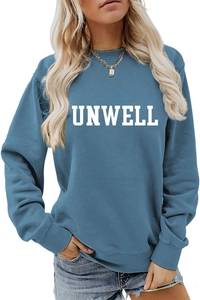 Close-up of UNWELL white letter print on a blue long-sleeve crewneck sweatshirt
