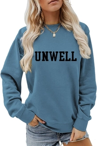 Detail of blue crewneck sweatshirt featuring black UNWELL letter print and soft fabric texture