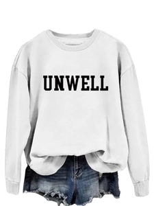 Flat lay close-up of white crewneck sweatshirt featuring black UNWELL letter print