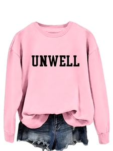 Detail of pink crewneck sweatshirt featuring bold black UNWELL letter print on chest