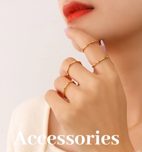 Close-up of a four-piece gold ring set featuring minimalist bamboo textures for women