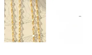 Detailed macro view of 18K gold plated lip-shaped link chain with fine metal craftsmanship