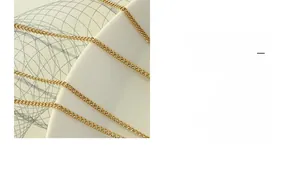 Close-up of polished 18K gold plated titanium steel chain with high gloss finish