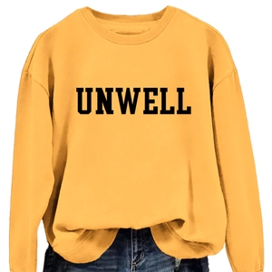 Yellow crewneck sweatshirt with black UNWELL print paired with blue denim jeans