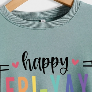 Sage green crewneck sweatshirt featuring Happy Fri-Yay print with red heart detail