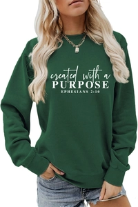 Detail of white religious lettering print on high-quality dark green cotton sweatshirt