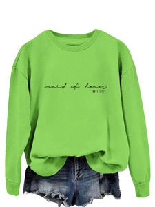 Detail of neon green crewneck sweatshirt with black maid of honor printed text