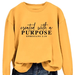 Ginger yellow crewneck sweatshirt with created with a purpose black letter print