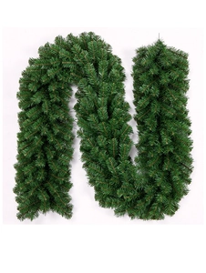Macro shot of 2.7m green PVC artificial Christmas garland with dense pine needles