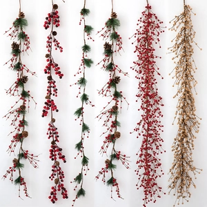 Five styles of Christmas red berry garlands with pine cones and golden accents on grey