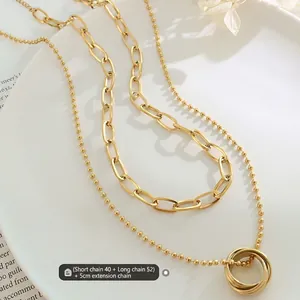 Collier double rang en acier titane plaqué or 18K avec pendentif triple anneau
