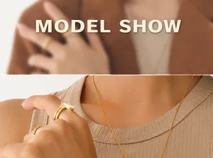 Detail of 18K gold plated bead necklace and wide ring with white shell inlay