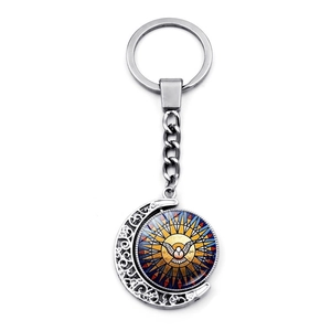 Religious dove keychain with spinning stained glass moon pendant on white background