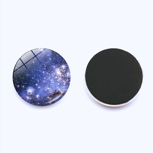Front and back views of a 25mm galaxy glass fridge magnet with magnetic backing