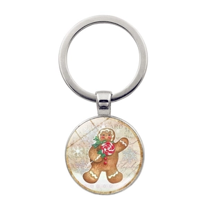 Dettaglio portachiavi natalizio con omino di pan di zenzero e stile cartolina vintage