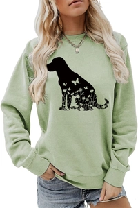 Détail de l'imprimé silhouette de chien floral sur sweat à col rond vert clair