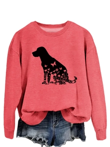 Détail de l'imprimé silhouette de chien à fleurs sur le sweat-shirt rose corail