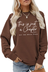 Close-up of the slogan print and ribbed neckline on this brown loose sweatshirt