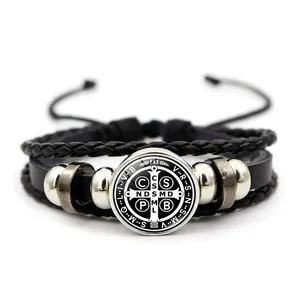 Detail of St. Benedict Medal leather bracelet with woven cords and metallic beads