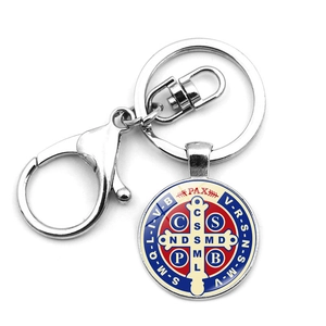 Saint Benedict Medal keychain with silver lobster clasp and red blue enamel details